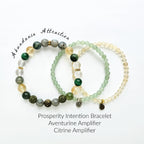 Three beaded bracelets with different colored stones on a white background