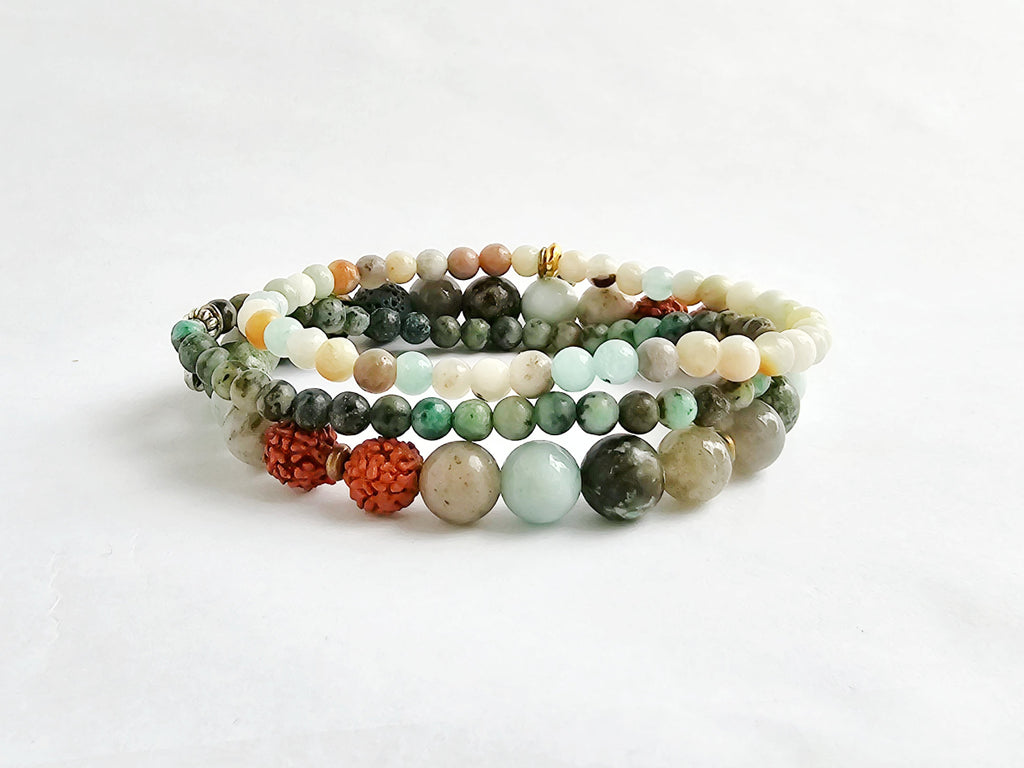 Set of multicolored beaded bracelets on a white background