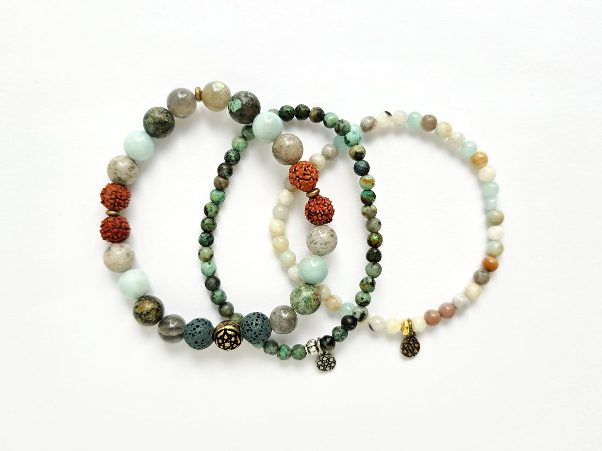 Set of three beaded bracelets on a white background