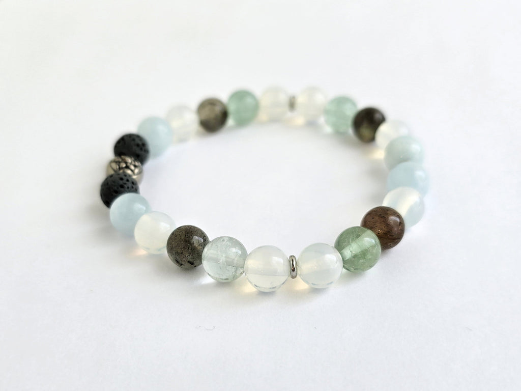 Beaded bracelet with various colored beads on a white background, featuring the text 'All is Well'.