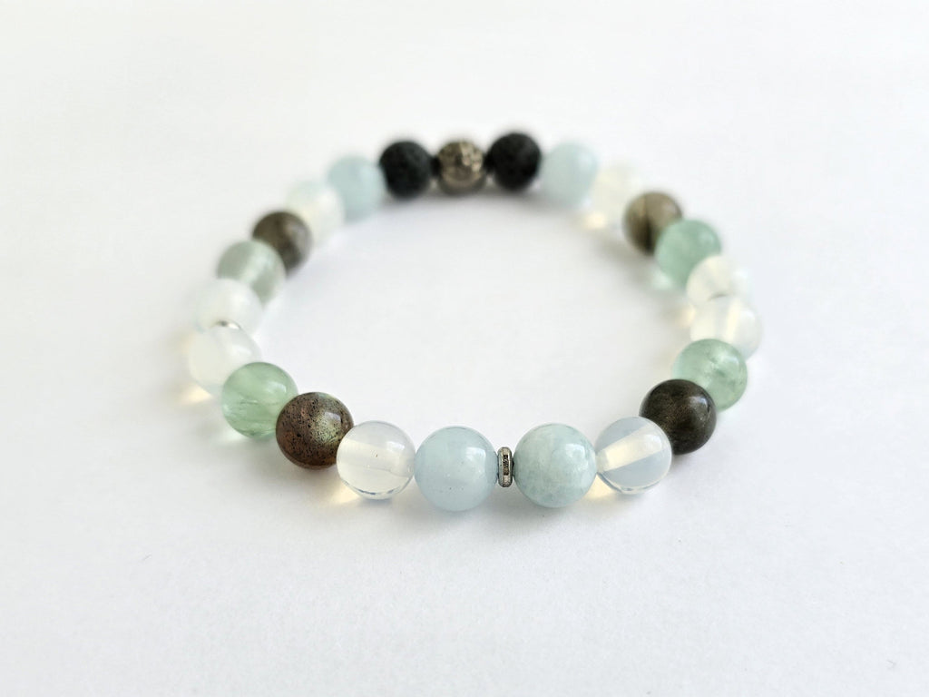 Beaded bracelet with various colored beads on a white background, featuring the text 'All is Well'.