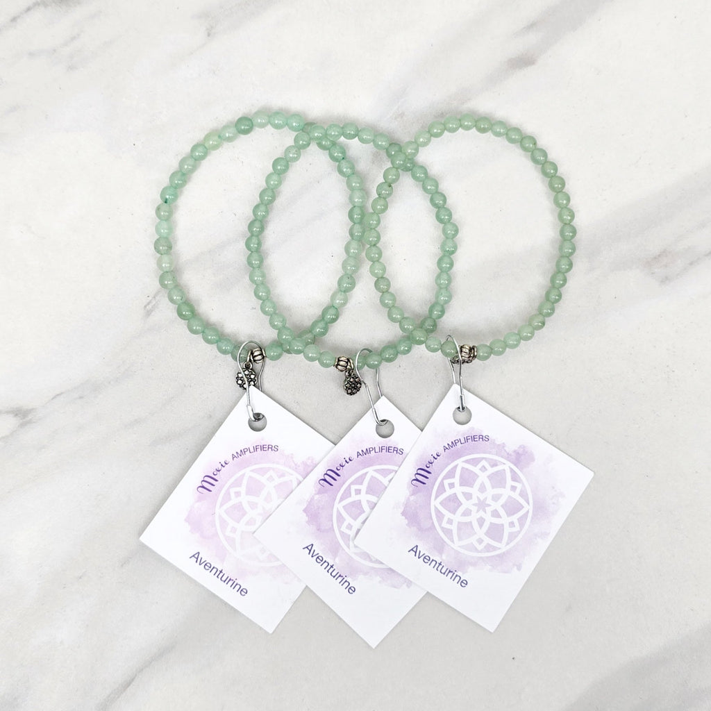 green beaded bracelets with matching cards on a marble surface galentine valentine bracelet bundle