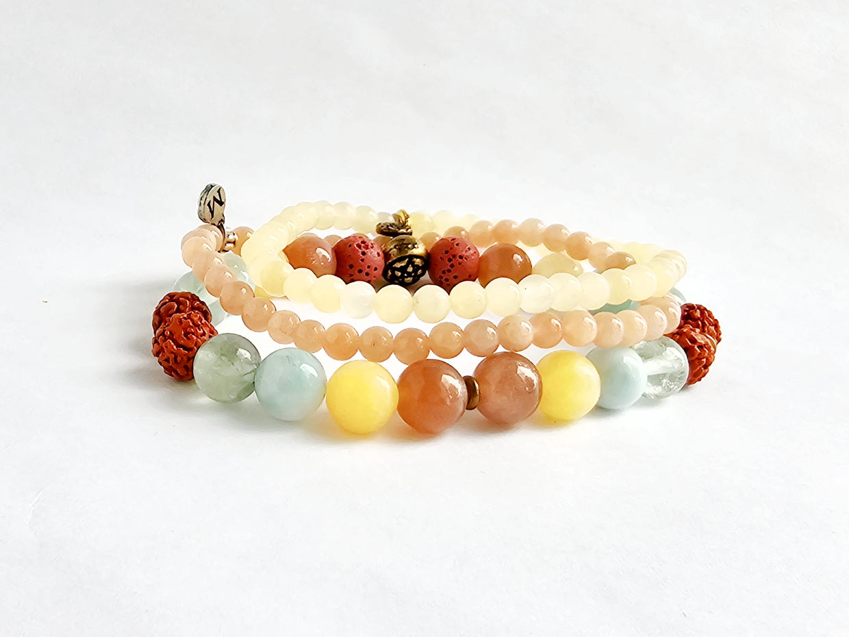 Set of multicolored beaded bracelets on a white background