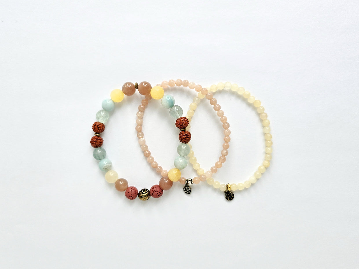 Three beaded bracelets on a white background