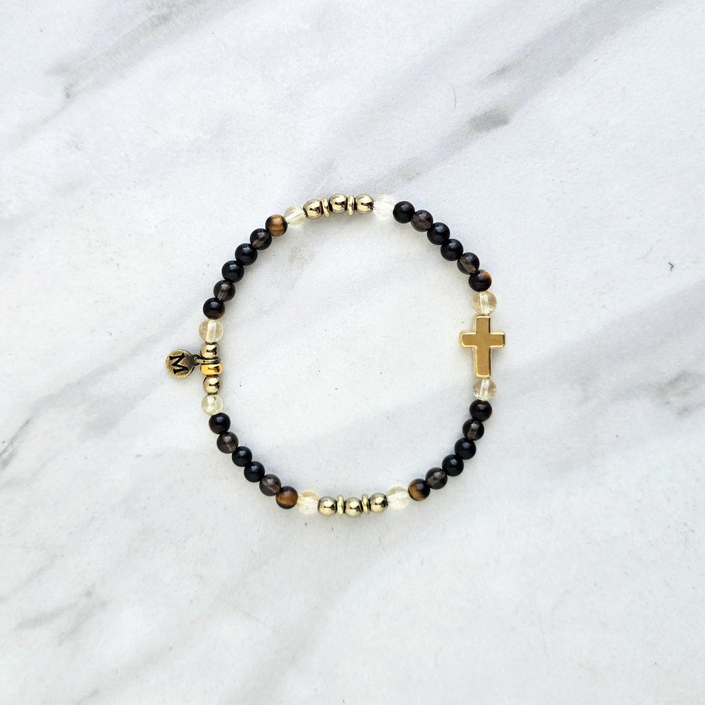 Christian Bracelet with beads and golden cross on a marble surface with Isaiah 41:10 do not be afraid courage bracelet