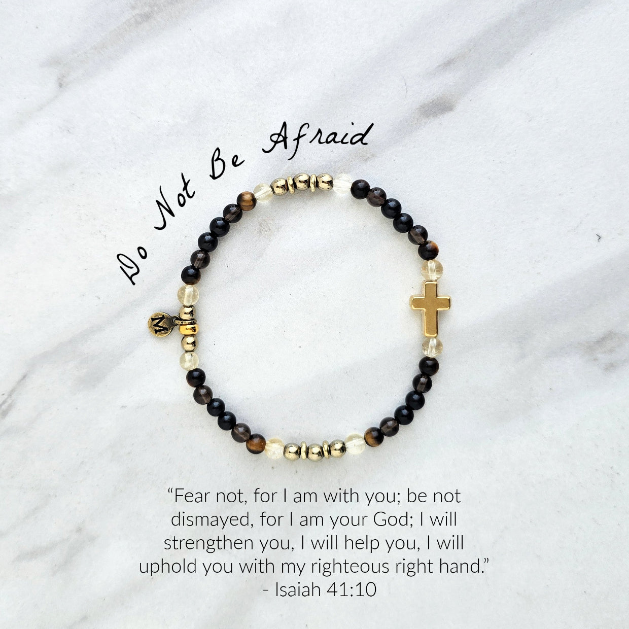 Christian Bracelet with beads and golden cross on a marble surface with Isaiah 41:10 do not be afraid courage bracelet