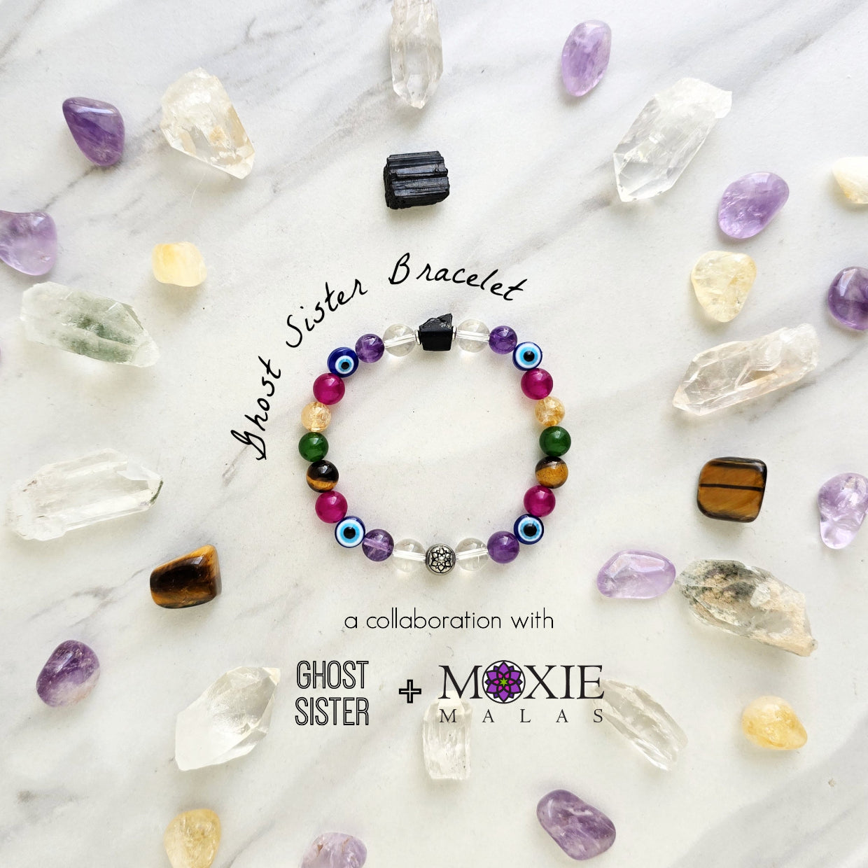 Colorful beaded bracelet on a white surface with crystals and text about collaboration between Ghost Sister and Moxie Malas.