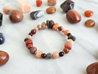 a healing home holiday exclusive, lake superior stone, crystal energy bracelet, oranges, rusts, burgundy, and gray lake stone, agates