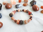 a healing home holiday exclusive, lake superior stone, crystal energy bracelet, oranges, rusts, burgundy, and gray lake stone, agates