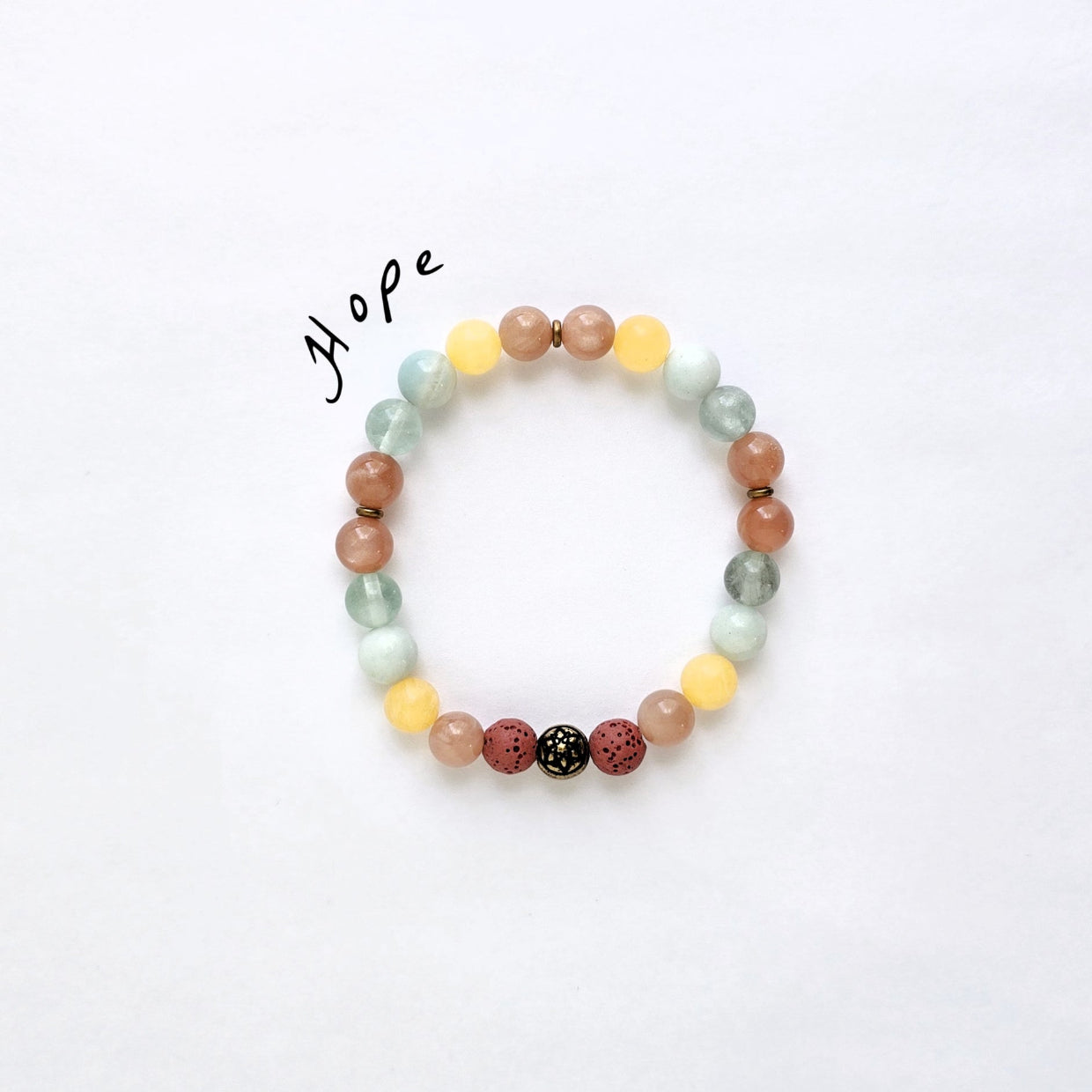Multicolored beaded bracelet on a white background with 'Hope' text.