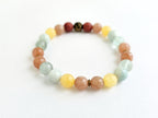 Multicolored beaded bracelet on a white background with 'Hope' text.