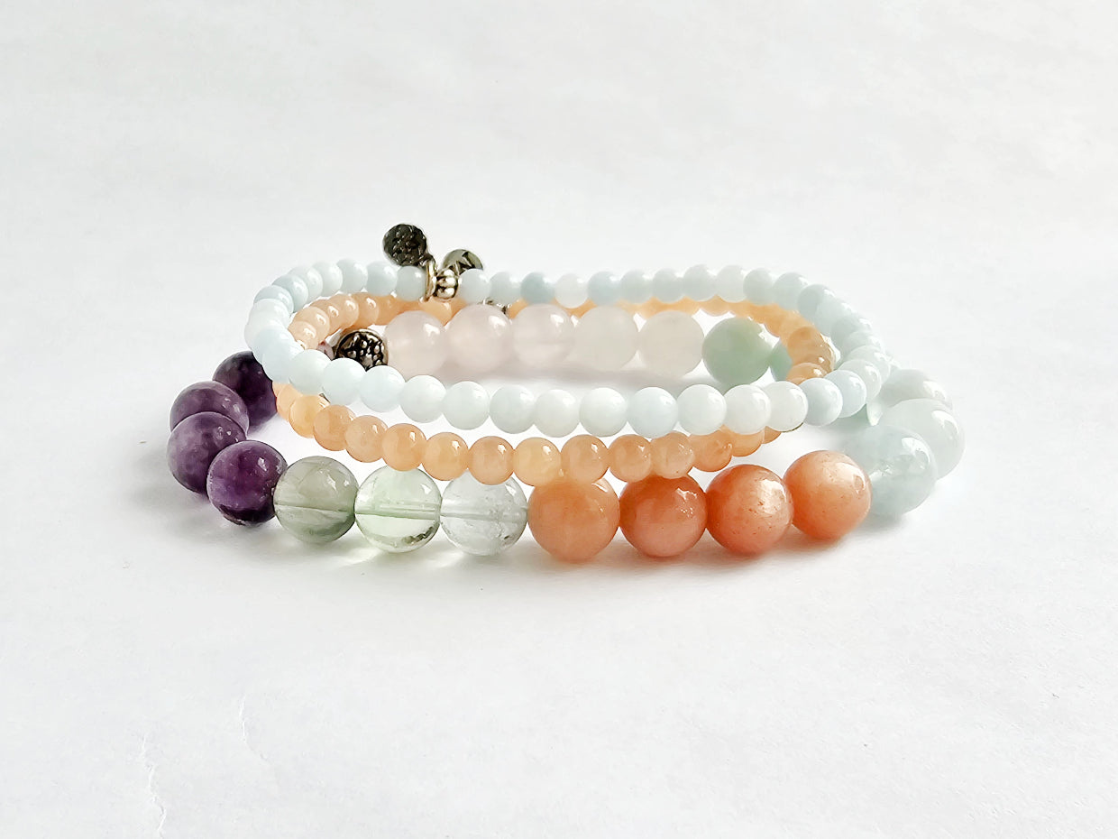 Set of beaded bracelets on a white background