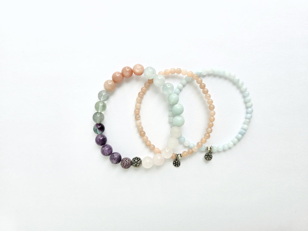 Set of three beaded bracelets on a white background