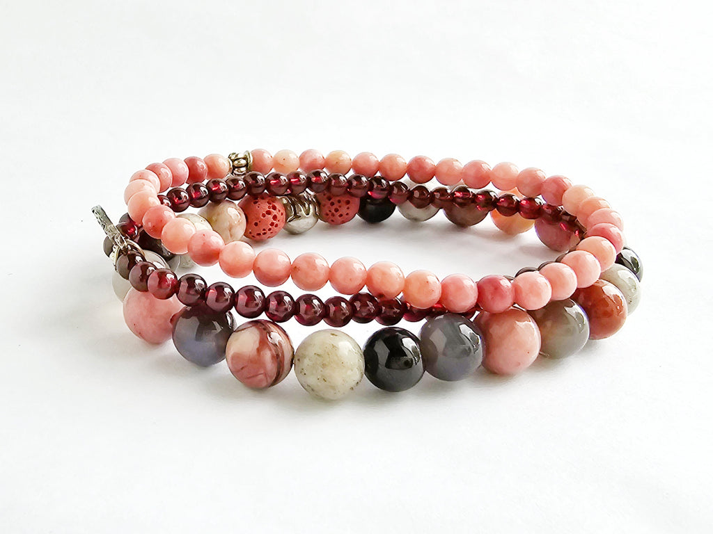 Set of multicolored beaded bracelets on a white background