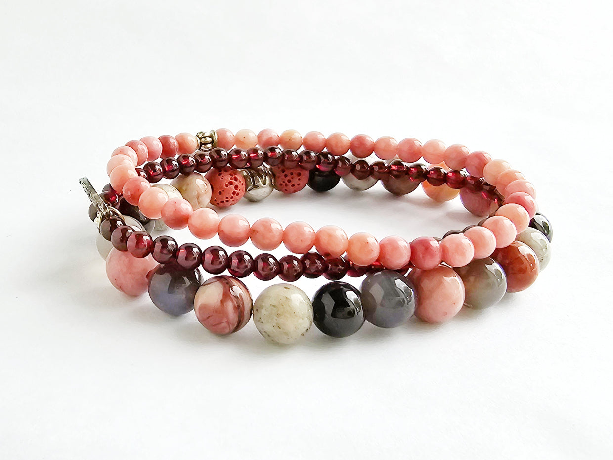 Set of multicolored beaded bracelets on a white background