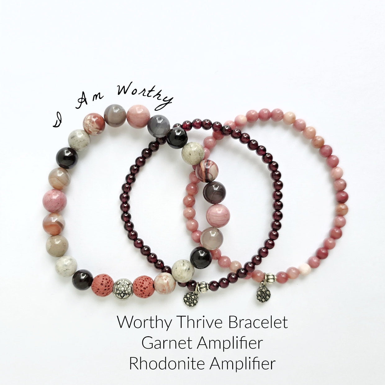 Set of beaded bracelets with garnet and rhodonite stones on a white background
