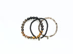 Set of three beaded bracelets on a white background