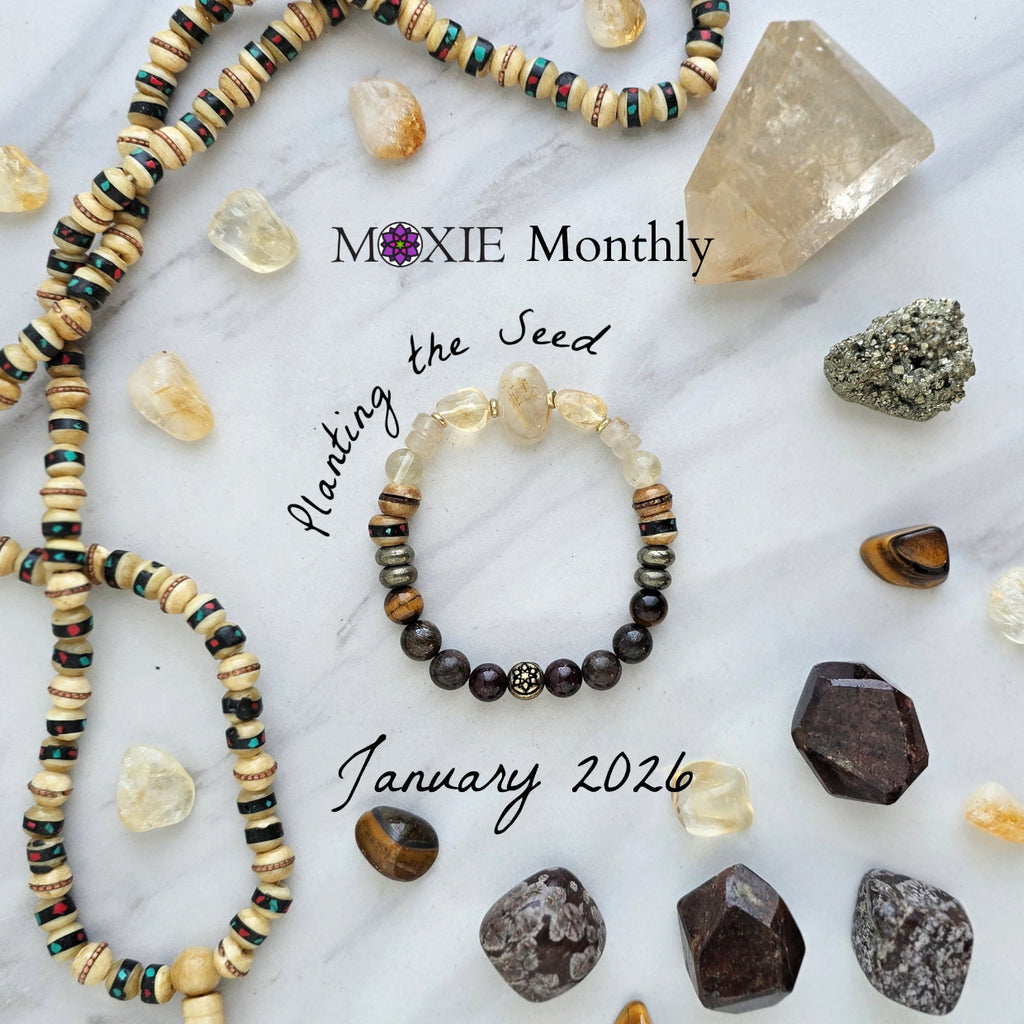 Bracelet with stones and beads on a marble surface with 'Moxie Monthly' branding. planting the seed january 2026 bracelet club