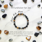 Bracelet with stones on a marble background, promoting a fundraiser for Joe Spannbauer bracelet