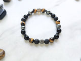 Bracelet with stones on a marble background, promoting a fundraiser for Joe Spannbauer bracelet