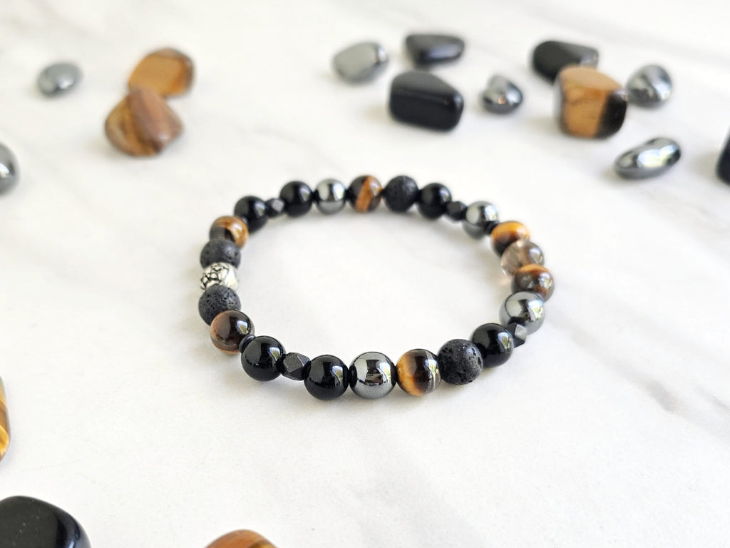 Bracelet with stones on a marble background, promoting a fundraiser for Joe Spannbauer bracelet