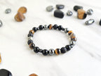 Bracelet with stones on a marble background, promoting a fundraiser for Joe Spannbauer bracelet
