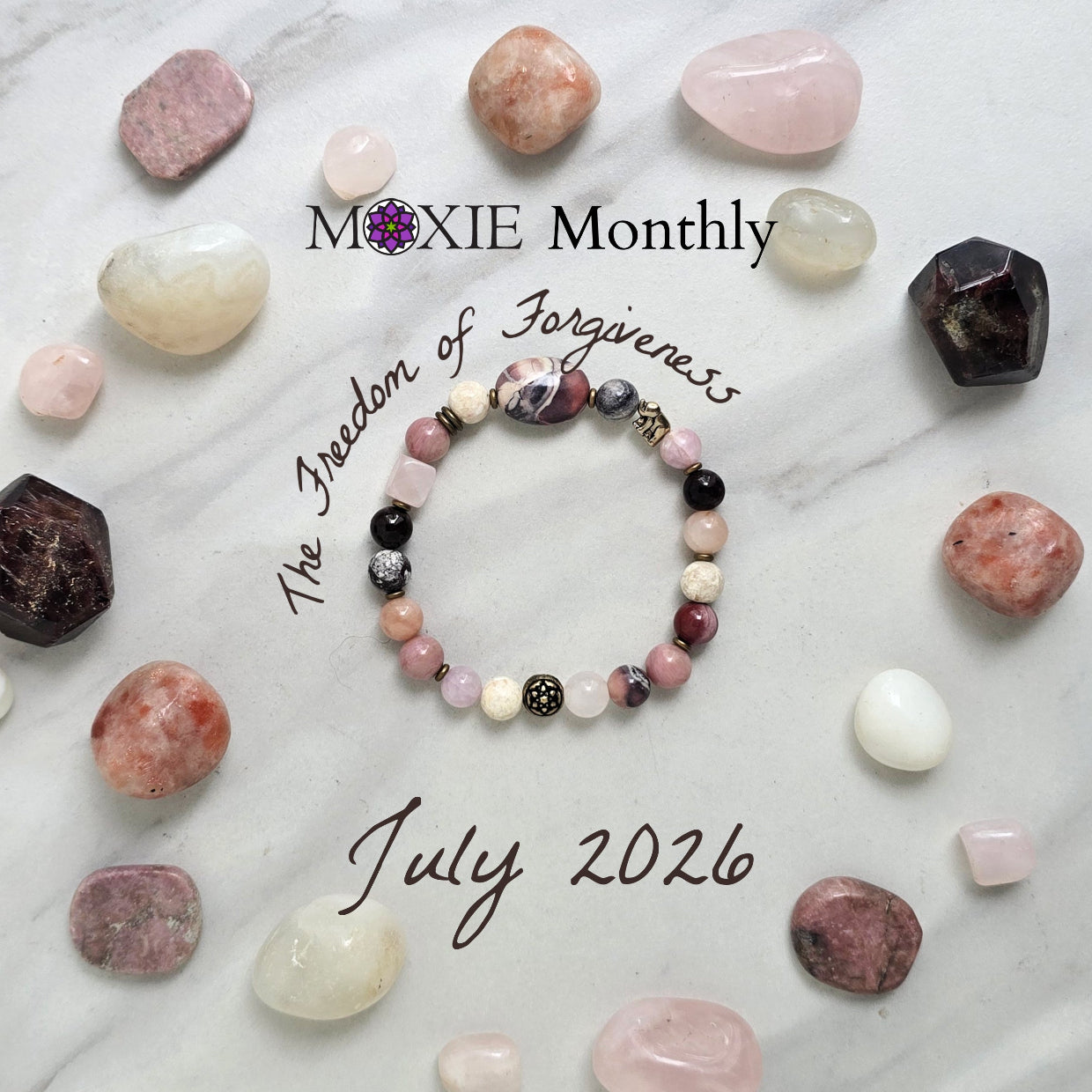 Bracelet with stones on a marble background, featuring 'Moxie Monthly' and 'The Freedom of Forgiveness'. elephant bead moxie monthly bracelet club