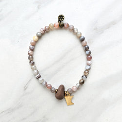 mn state brass charm botswana agate beads with lake superior stone bracelet on a white background