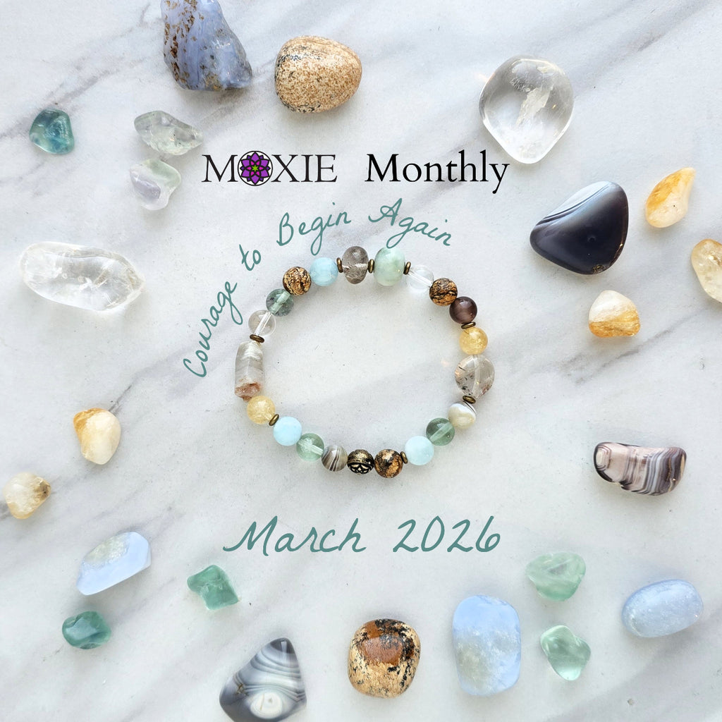 Bracelet with stones on a marble surface, featuring 'Moxie Monthly' march 2026 courage to begin again bracelet club 