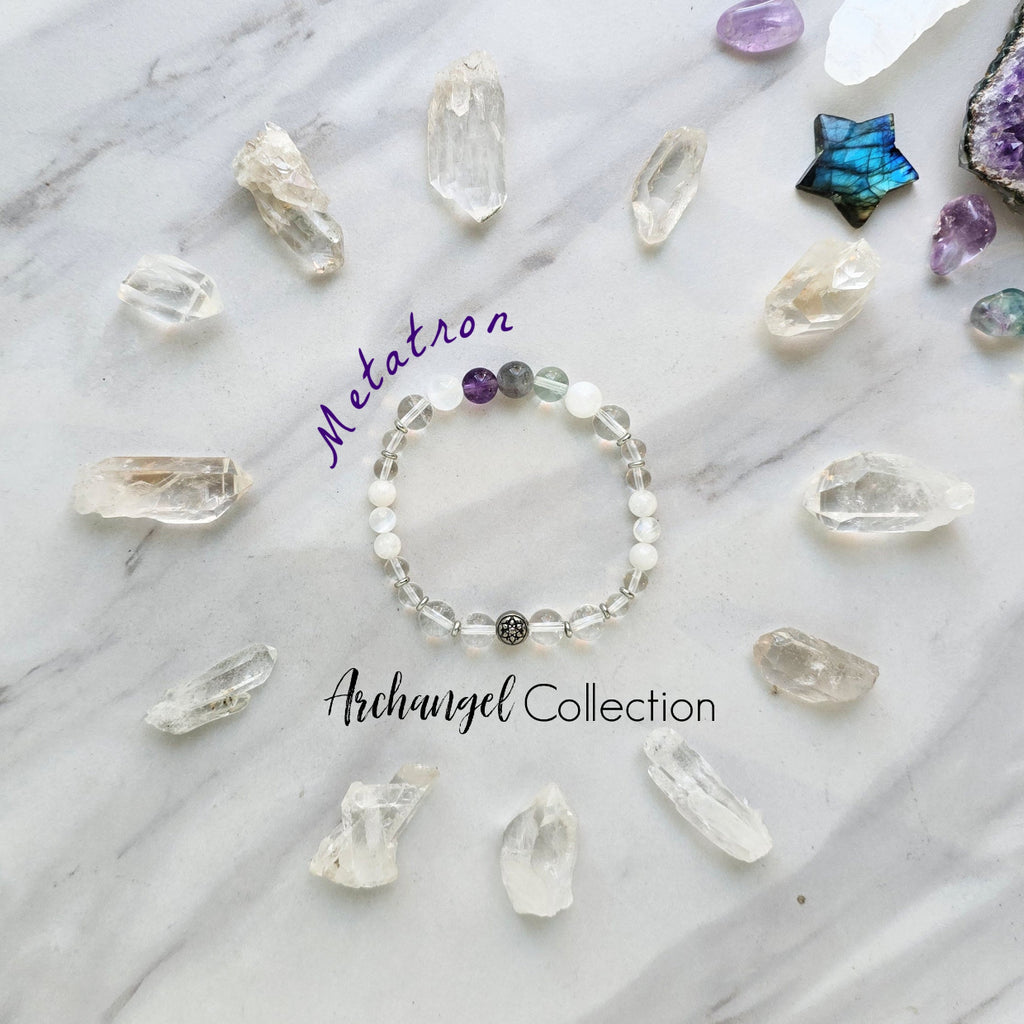 Bracelet with crystals on a marble surface, featuring 'Metatron' and 'Archangel Collection'. Archangel Metatron crystal bracelet