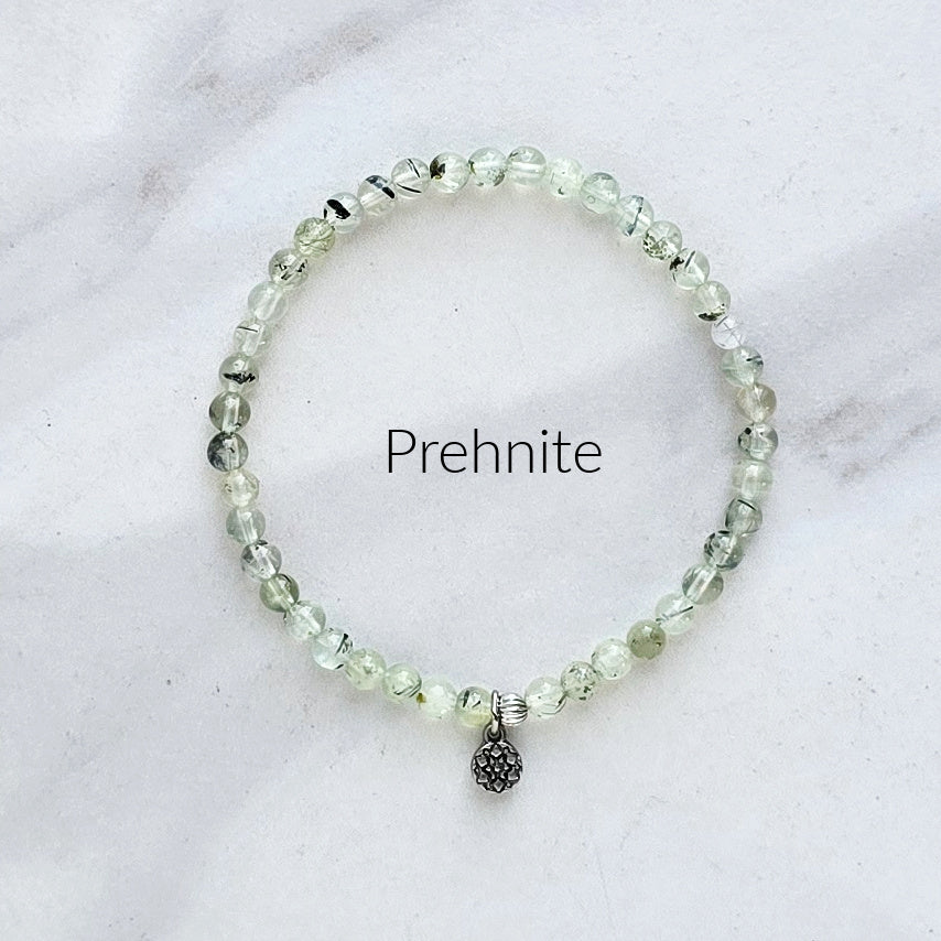 Prehnite beaded bracelet on a white marble background with 'Prehnite' text.