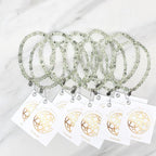 Three beaded bracelets on white cards with 'Prehnite' and 'Bestie Bundles' text on a marble background. valentines gifts galentines day