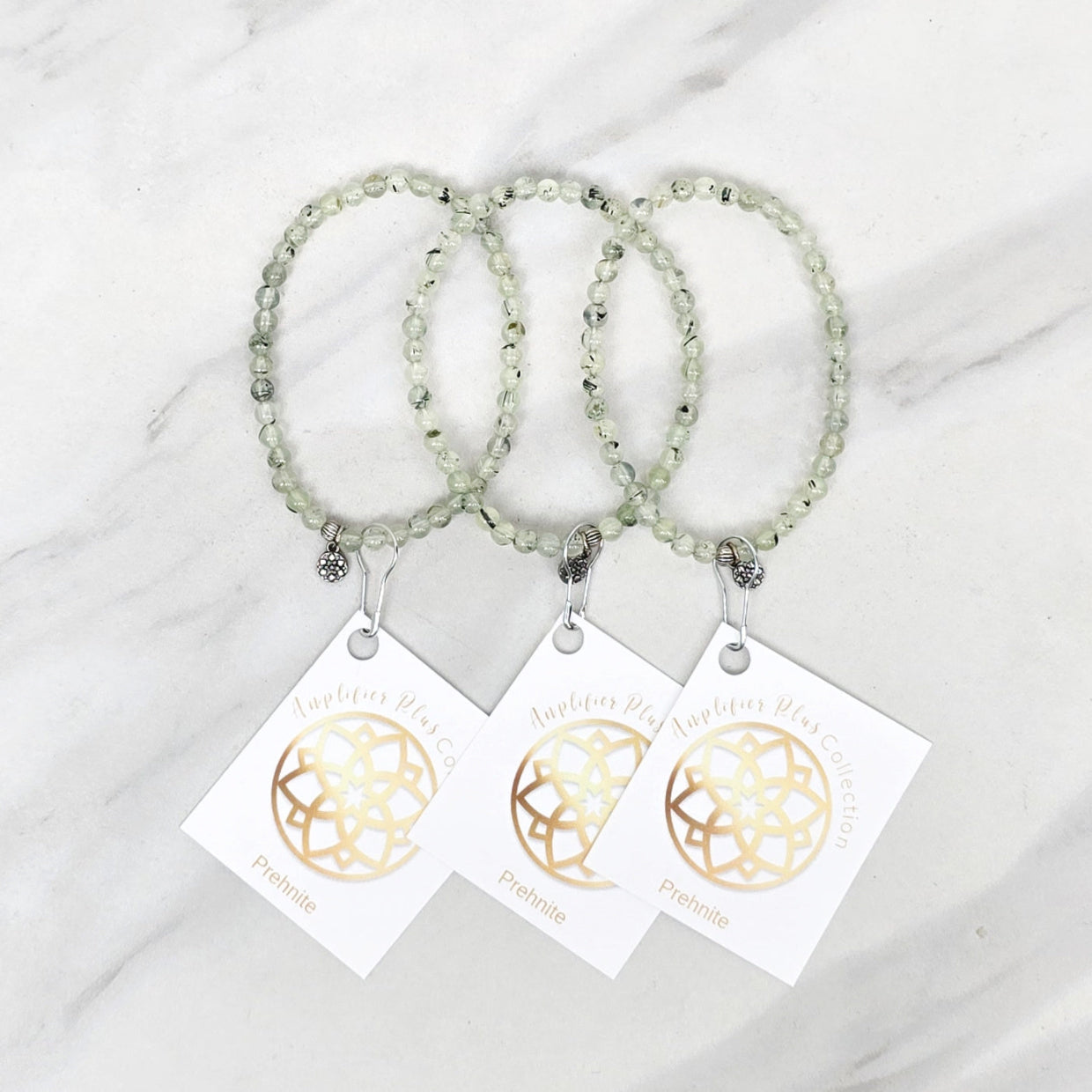 Three beaded bracelets on white cards with 'Prehnite' and 'Bestie Bundles' text on a marble background. valentines gifts galentines day