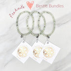Three beaded bracelets on white cards with 'Prehnite' and 'Bestie Bundles' text on a marble background. valentines gifts galentines day