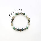 Beaded bracelet with 'purpose' text on a white background