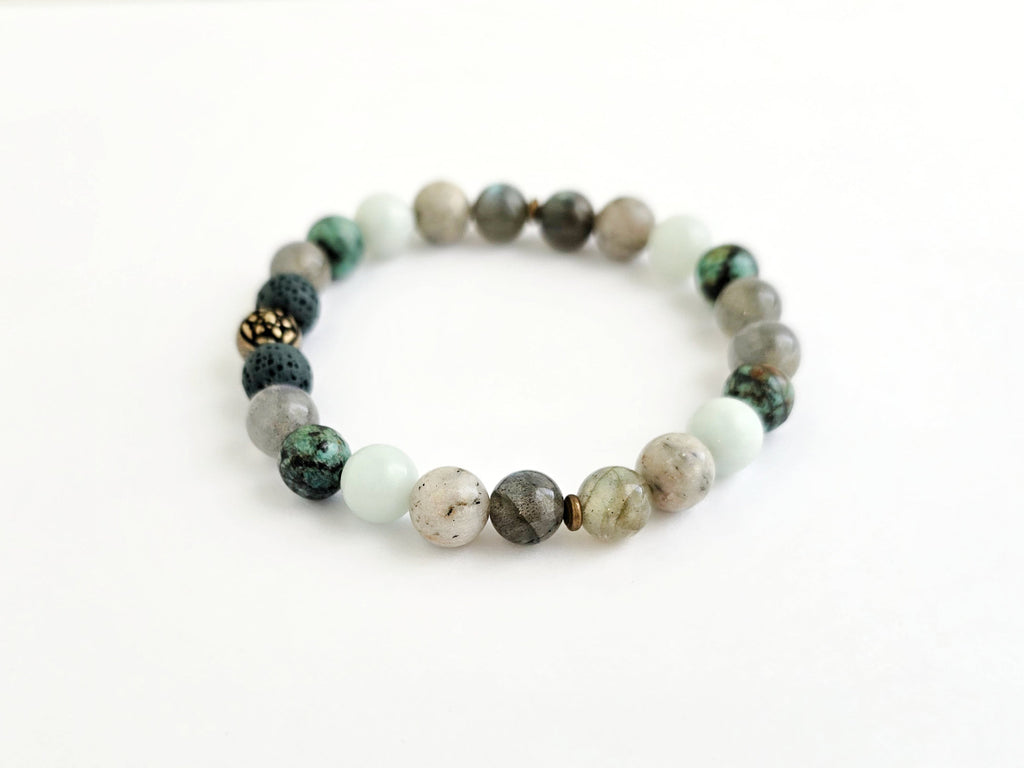 Beaded bracelet with 'purpose' text on a white background