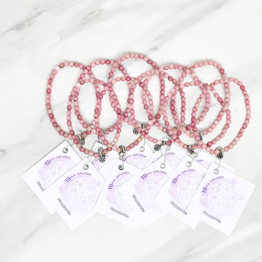 Three pink rhodonite beaded bracelets on cards with 'Rhodonite' text, branded 'Rhodonite Bestie Bundles' on a marble background. valentine gifts galentines day
