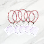 Three pink rhodonite beaded bracelets on cards with 'Rhodonite' text, branded 'Rhodonite Bestie Bundles' on a marble background. valentine gifts galentines day
