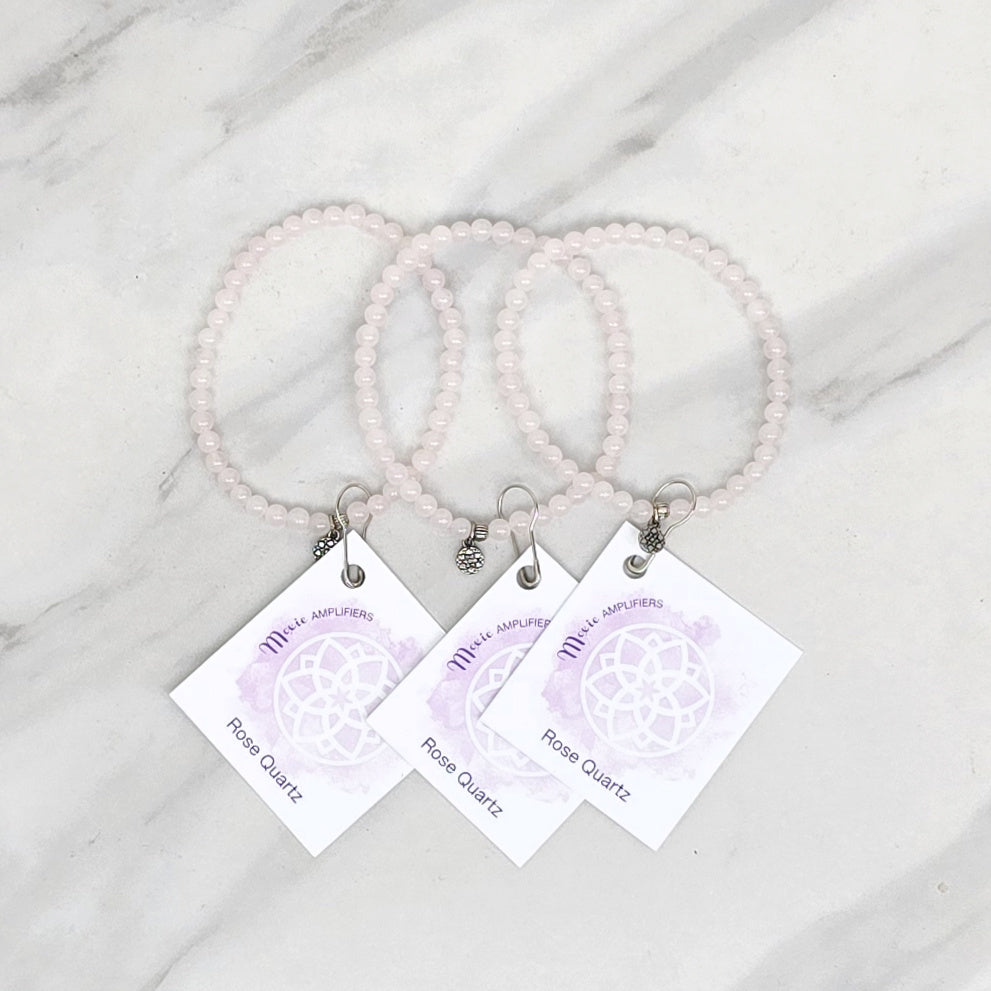 rose quartz bracelets with matching cards on a marble surface, branded 'Rose Quartz Bestie Bundles'. valentine gift galentines day