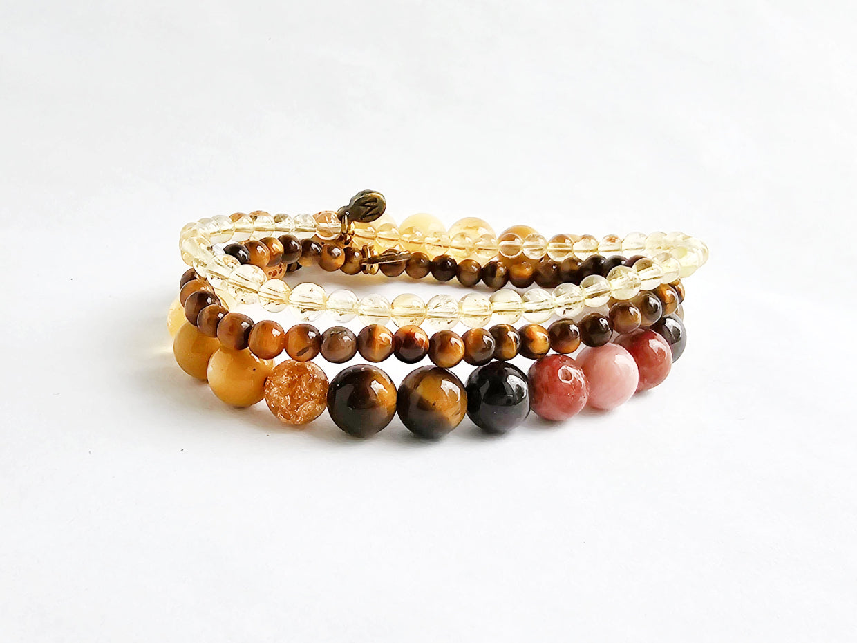 Set of beaded bracelets on a white background