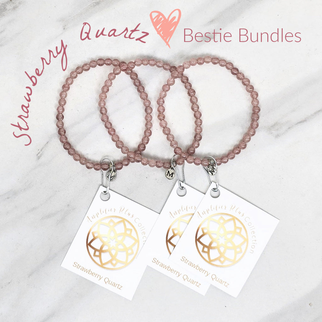 Two strawberry quartz beaded bracelets with matching tags on a marble surface. valentines day galentines gifts