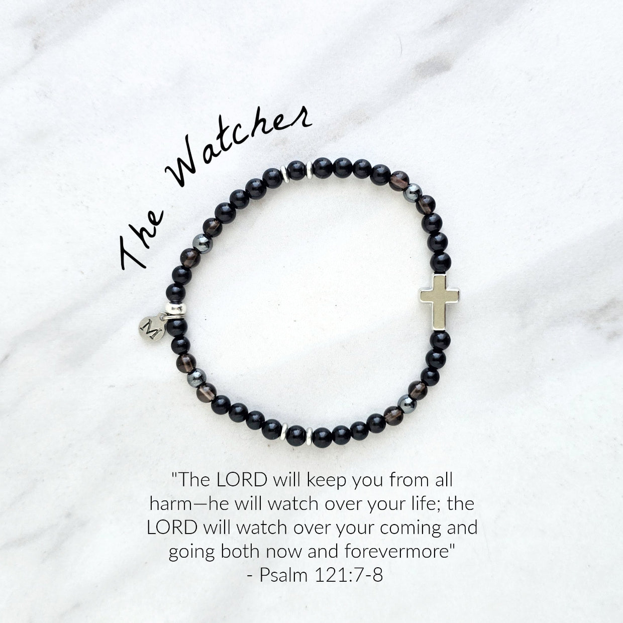 Black beaded bracelet with a cross charm on a white fabric background, the watcher Christian bracelet psalm 121:7-8