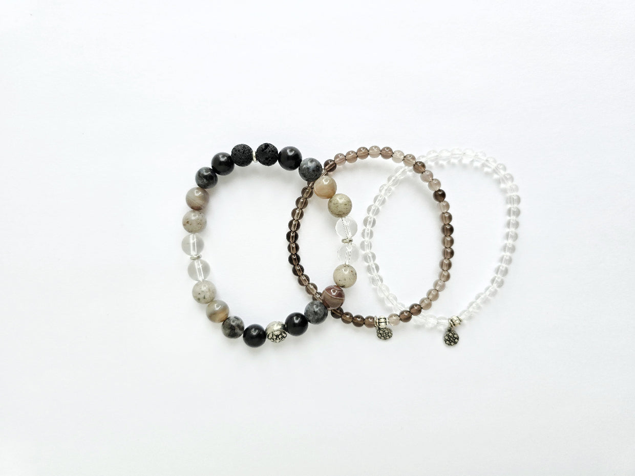 Three beaded bracelets on a white background