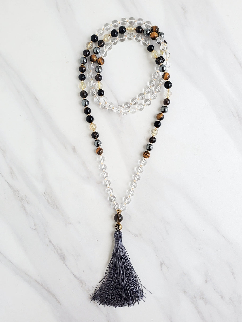 archangel uriel black gold and brown with clear quartz moxie malas mala