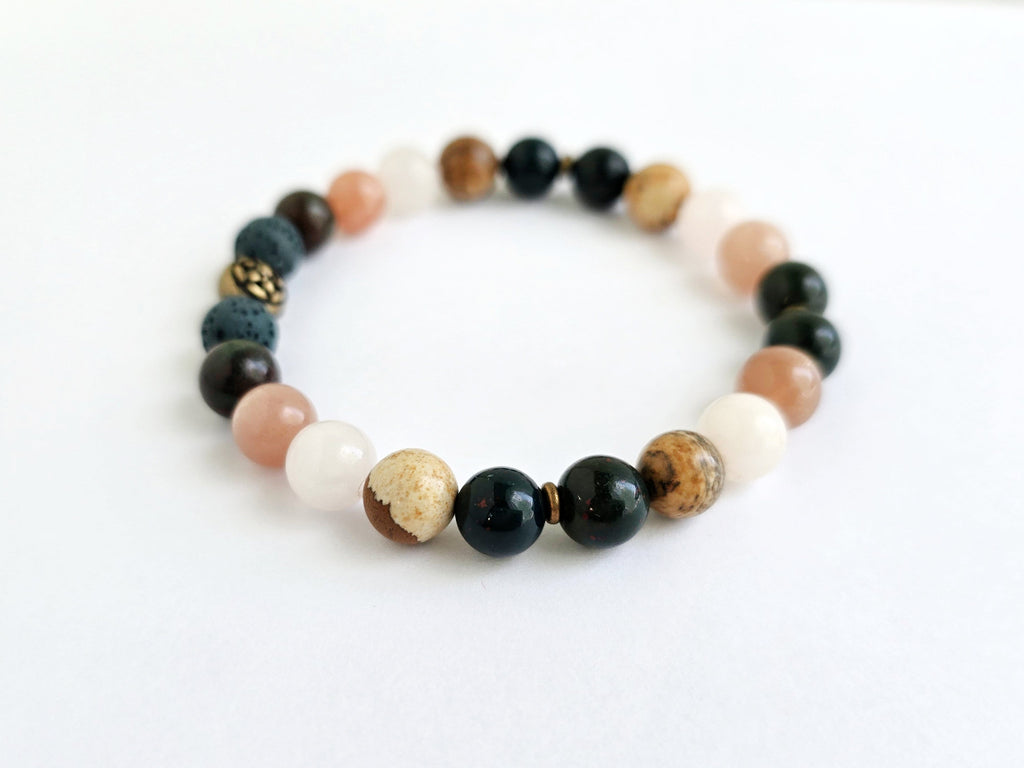 Beaded bracelet with various colored beads on a white background, labeled 'Well-being'.