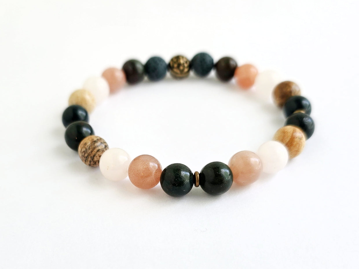 Beaded bracelet with various colored beads on a white background, labeled 'Well-being'.