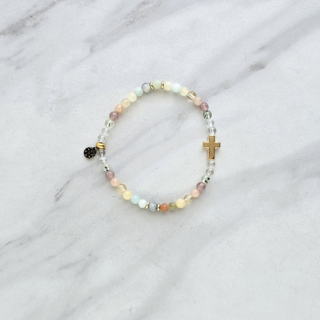 Beaded bracelet with a cross charm on a marble surface, featuring a religious quote. psalms 139:13-14 Christian bracelet wonderfully made