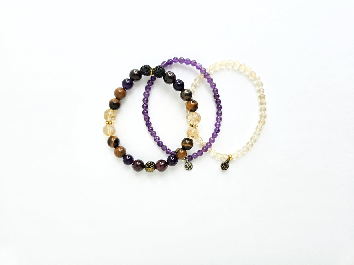 Three beaded bracelets on a white background
