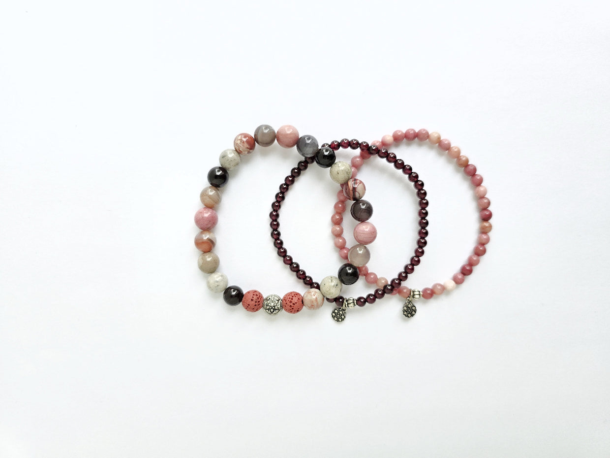 Three beaded bracelets on a white background